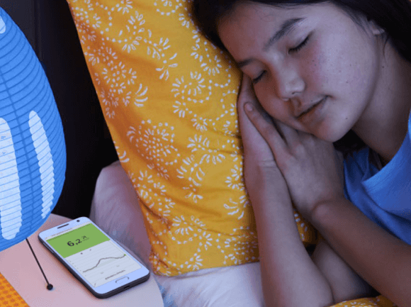 Person sleeping with glucose monitor
